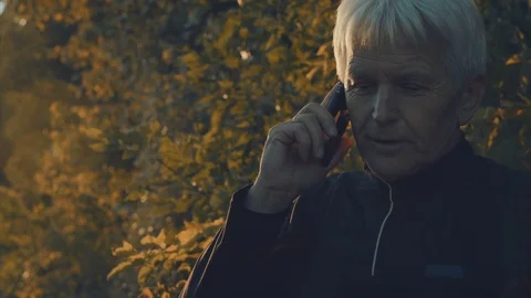 A telephone call while jogging Stock Footage 70486331