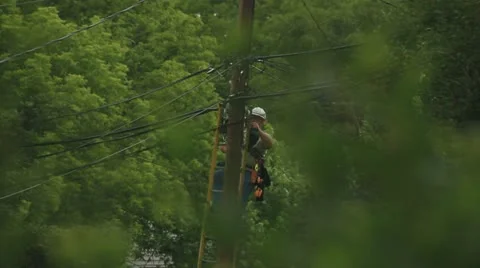 Telephone Lineman hooking up cable Stock Footage 11267089