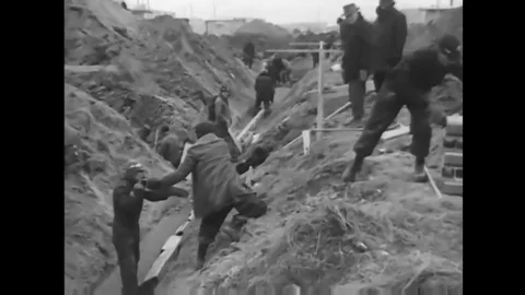 Telephone lines are installed for the army b the Network Bell company in the Stock Footage 145417233