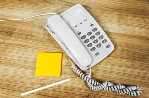 Telephone white on a table Stock Photos