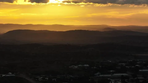 Telephoto aerial view across layered outback hills near Broken Hill glowing Video stock 342339341
