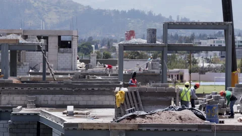 Telephoto of construction workers at work in the mountains slow motion Vidéo 163384589