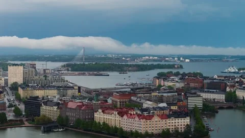 Telephoto hyperlapse drone shot of rolling clouds approaching Helsinki city Stock Footage 336710744