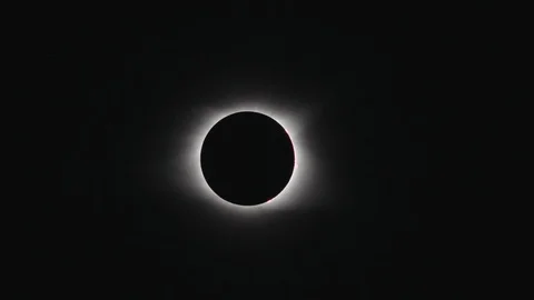 A telephoto shot of the total solar eclipse as it ends in a beautiful Stock Footage 125561709