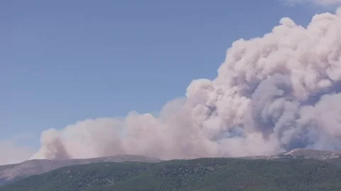 Telephoto view of a developing pyrocumulus cloud above the Tiétar Valley Stock Footage 343897898