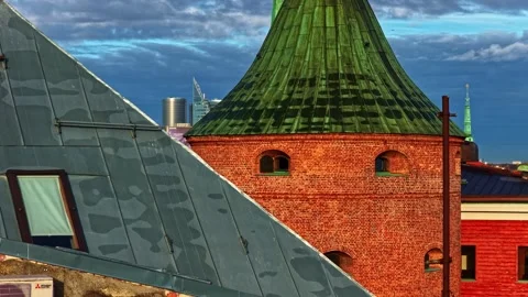 Telephoto view over Riga rooftops with historic green church spires, modern Stockbeeldmateriaal 335350582