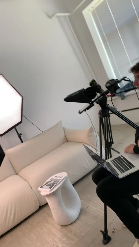 Teleprompter professionally displays script as host adjusts position Video stock 303065624