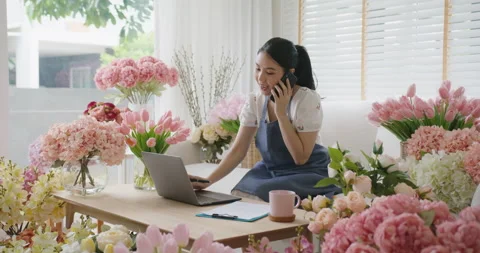 Telesale phone call checking stock by Gen Z SME owner at home office. 스톡 동영상 174607944