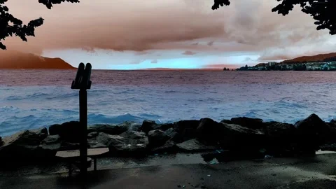 Telescope and Tree Branch on the Waterfront on Lake Geneva with Big Waves and Stock Footage 337855115