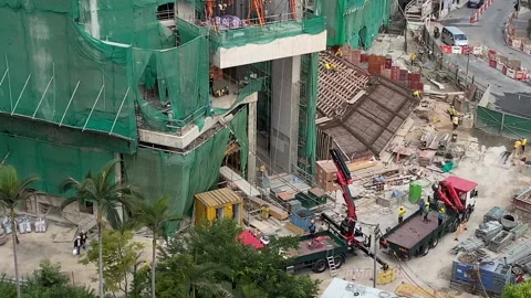 Telescope crane lifting escalator on construction site Stock Footage 144602911