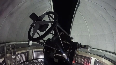 Telescope moving inside the dome of an observatory. Stock Footage 81189430