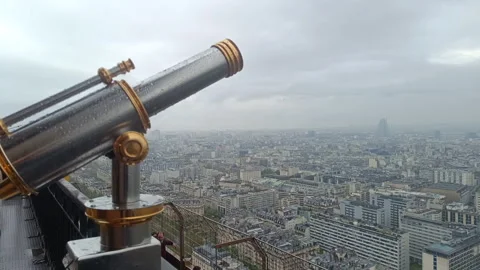 Telescope with raindrops on an observation deck with a panoramic view of Paris Stock Footage 336691662