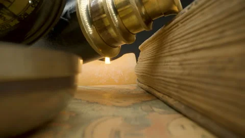 Telescope spotting scope with the thick book on the map Stock Footage 147262264