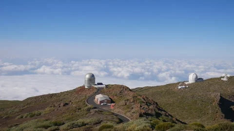 Telescopes of the Roque de los Muchachos Observatory on La Palma island above a Stock Footage 317554875