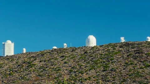 Telescopes of the space observatory on the hill of a high mountain volcano Stock Footage 119861848