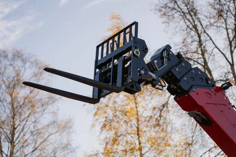 Telescopic handler fork attachment lifting mechanism on hydraulic boom arm Stock Photos
