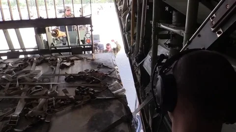 Telescopic handler loading C-130 Hercules Stock Footage 83821241