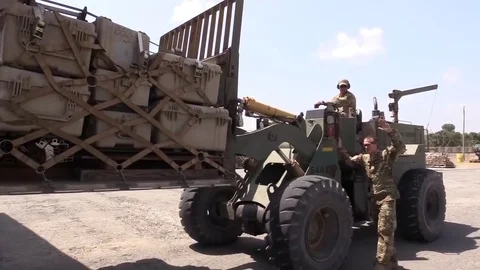Telescopic handler loading cargo onto C-130J Hercules 스톡 동영상 83821110