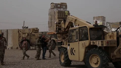 Telescopic handler loading crates onto truck Stock Footage 87825465