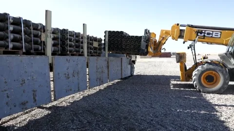 Telescopic handler loading pallet of ammunition onto truck at Al Asad Air Base Stock Footage 168740832