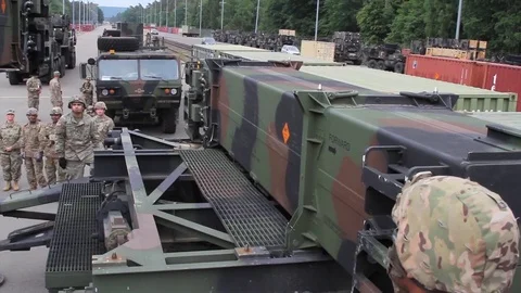 Telescopic handler loading patriot missile onto trailer Stock Footage 90120767