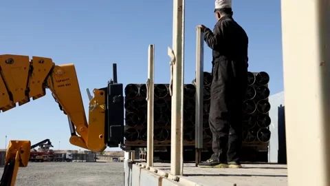 Telescopic handler loads pallet of ammunition onto truck at Al Asad Air Base Stock Footage 168740808