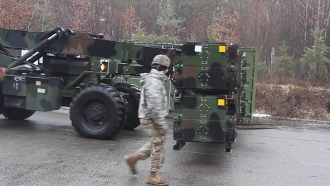 Telescopic handler transporting Patriot missiles Stock Footage 102707597