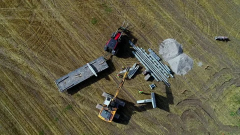 Telescopic handler unloading materials for building on the the site. Stock Footage 231838654