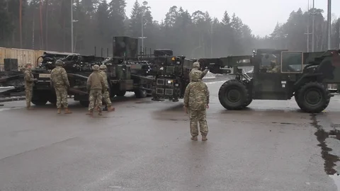 Telescopic handler unloading Patriot missile from trailer at Baumholder, Germany Stock Footage 102707607