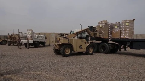 Telescopic handler unloading truck Stock Footage 87826189