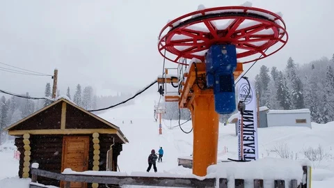 Teletsky Altai winter mountain ski resort. Elevator on mount and forest backg Stock Footage 88503447