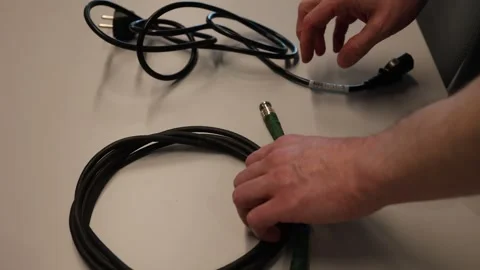 Television broadcasting audio video connection cable on the table Vídeos de archivo 345723874
