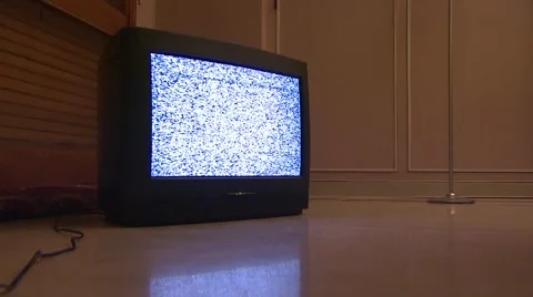Television displaying static reflected in floor Stock Footage 6493171