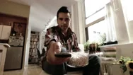 Television Pov Of Man Eating Popcorn, Watching Tv Using Remote Control Stock Footage