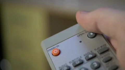 Television remote control close-up. Change channels on the TV using remote .. Video stock 257874188