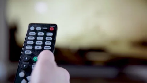Television remote control remotely via a TV remote control, switching program Stock Footage 121769975