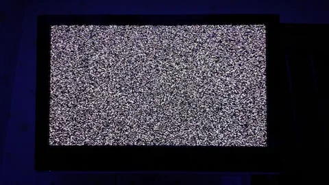 Television Screen Displaying Static Noise in Dark Room Stock-Footage 305654759