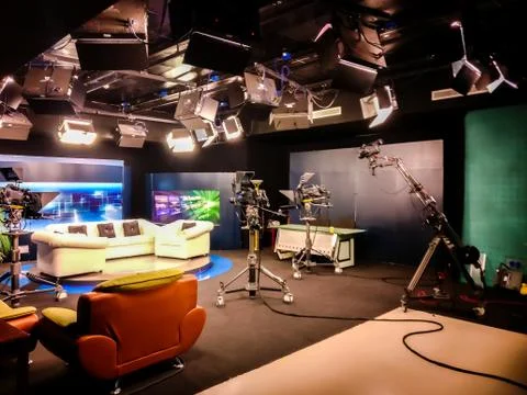 Television studio with camera, lights and coach for interview for recording Stock Photos