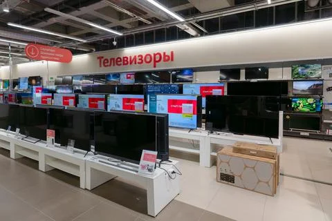 Televisions in rows in an electronics store in Russia Stock Photos