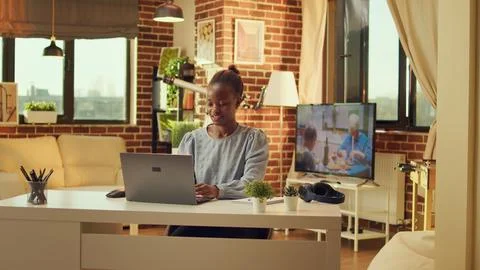 Teleworker concludes web based tasks Stock Photos