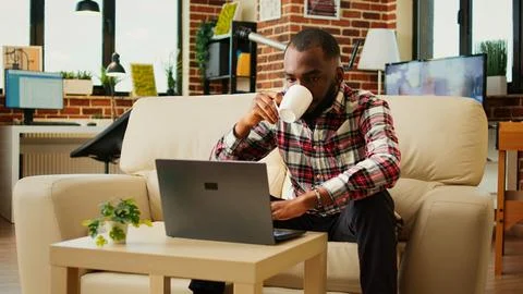 Teleworker performing tasks at home Stock Photos