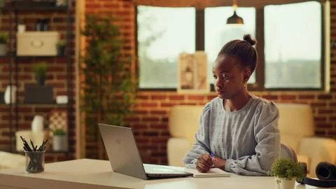 Teleworker taking notes about tasks Foto stock