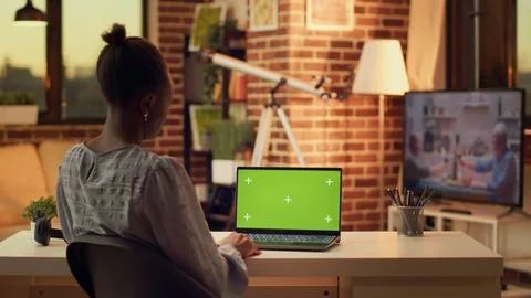Teleworker using greenscreen on laptop Stock Photos