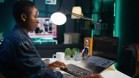 Teleworker using laptop to do coding for software developing Stock Footage 319520624