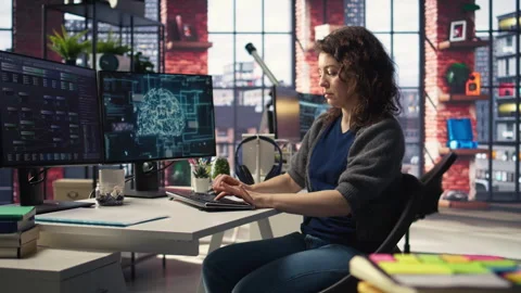 Teleworking developer using computer for artificial intelligence computing Stock Footage 308603228