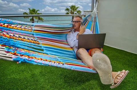 Teleworking from a hammock Fotos de archivo