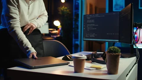 Teleworking programmer arriving in home office, starting coding Stock Footage 283593311