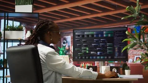 Teleworking programmer using computer for artificial intelligence developing Stock Photos