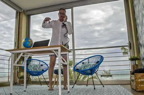 Teleworking in shorts Stock Photos