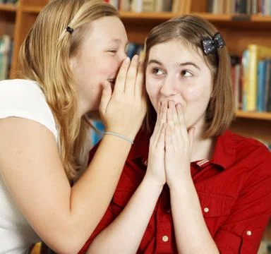 Telling Secrets in School Stock Photos